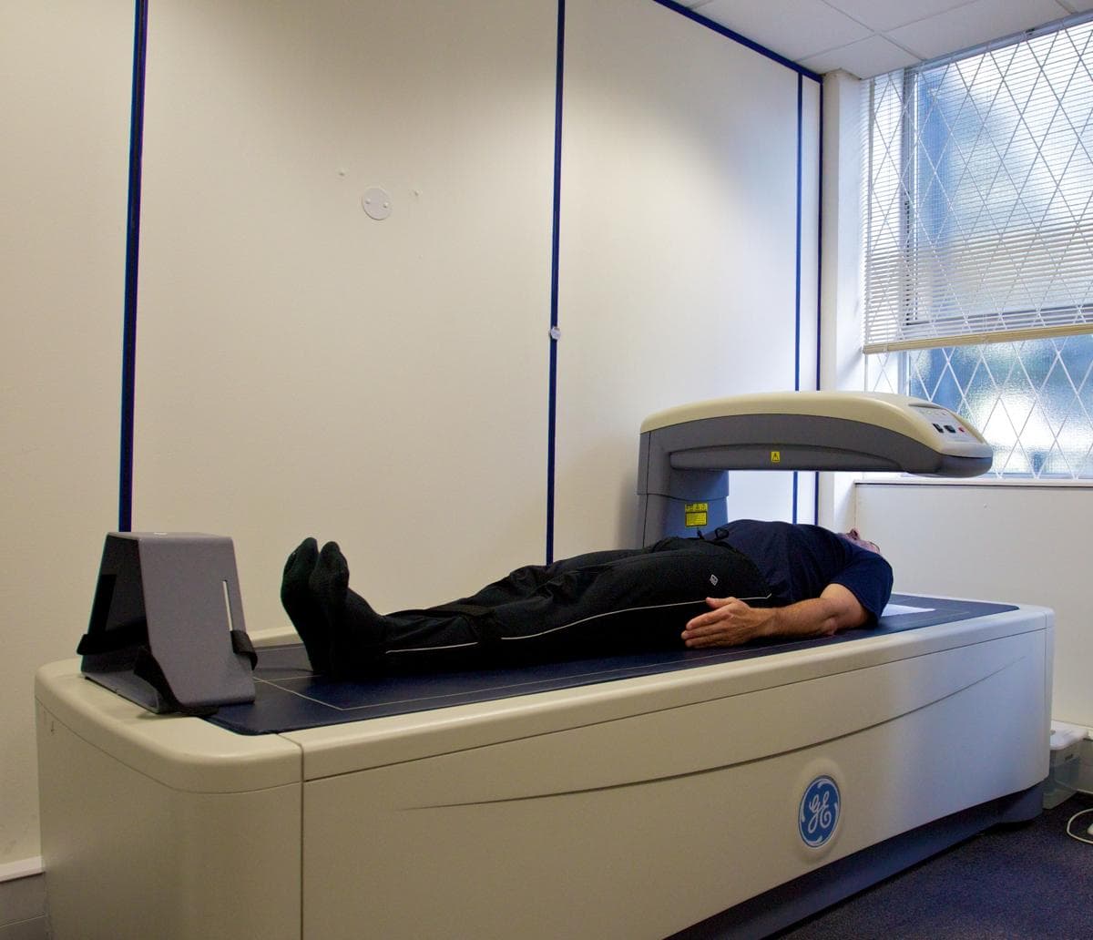 DEXA scan procedure showing patient on bone density scanner at DCDC Dubai Healthcare City